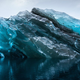The glassy blue glow of a flipped iceberg.